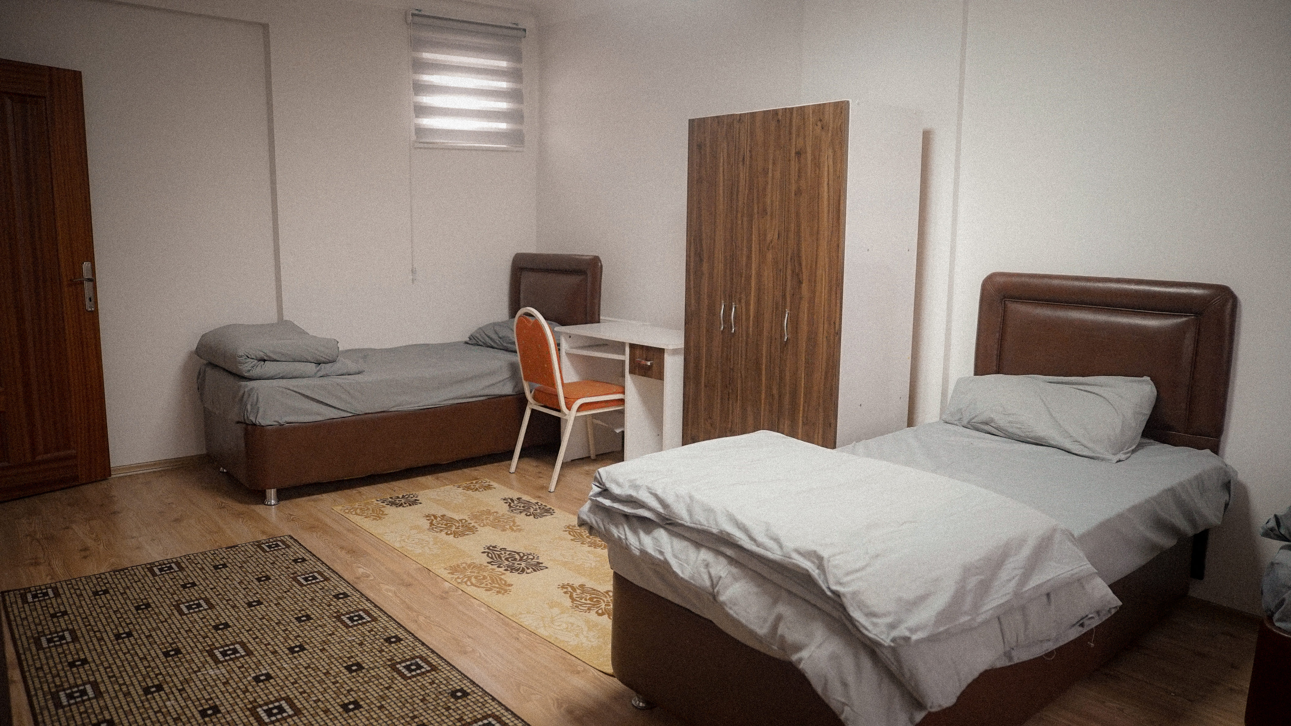 Students studying and socializing in modern dormitory common area - vibrant student life at Aksa Private Higher Education Men's Dormitory Ankara