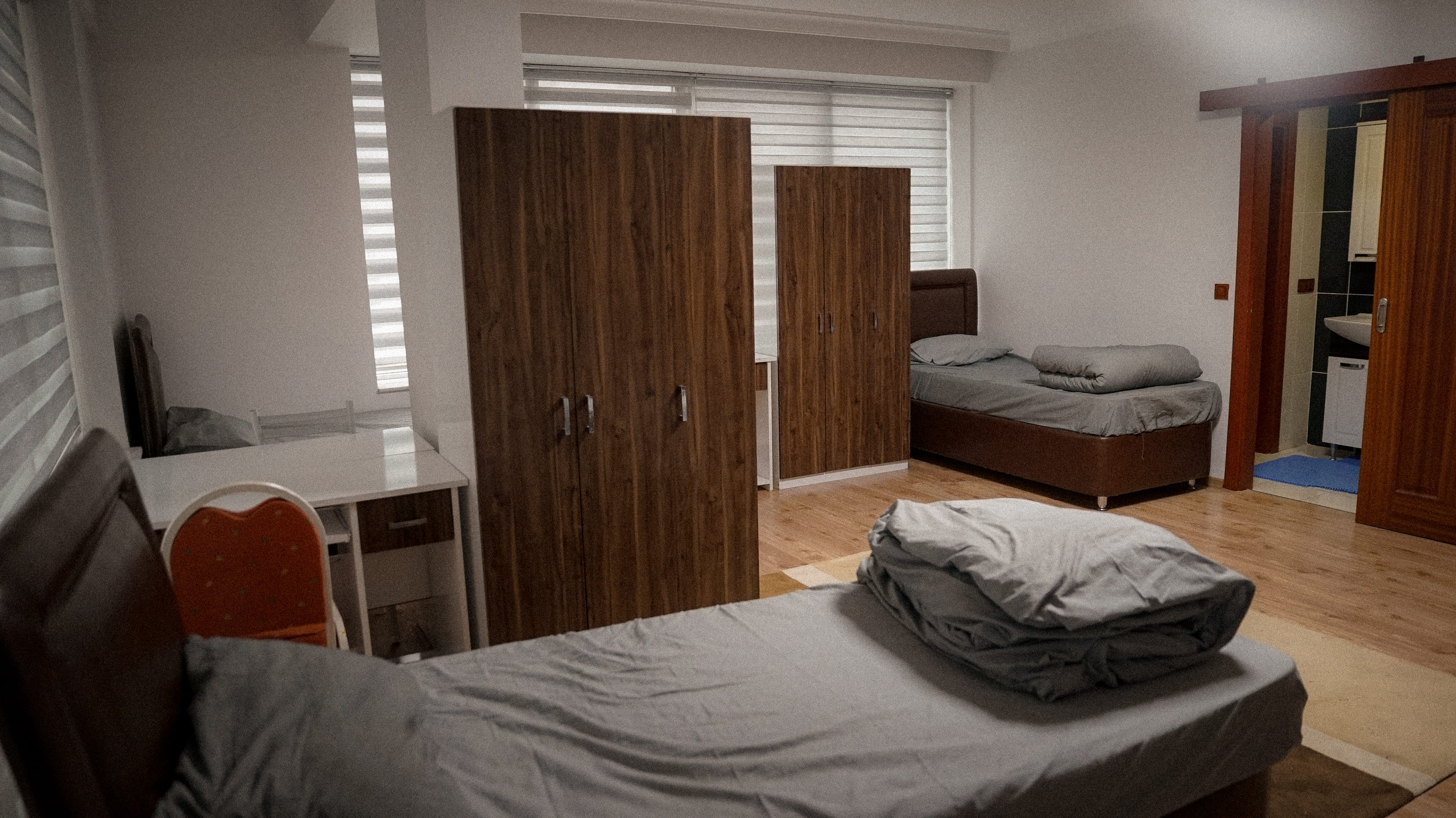 Student accommodation rooms - Well-furnished living spaces with study desks and storage